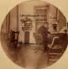 Man_in_office_with_kerosene_lamp_round_photo_OM.jpg (172326 bytes)